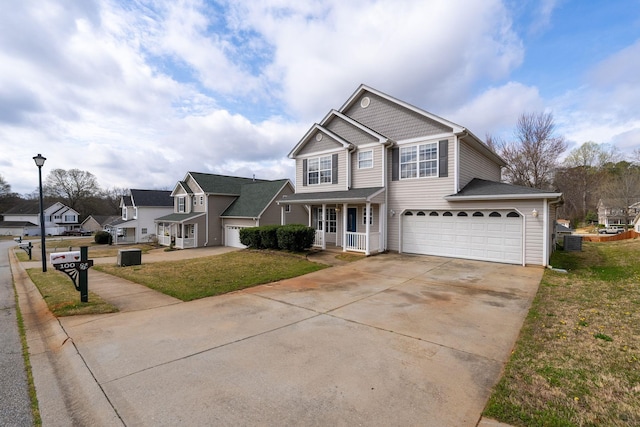 100 Maximus Dr, Greer, SC 29651 - view of front of property with driveway, a front yard, a porch, and an attached garage
