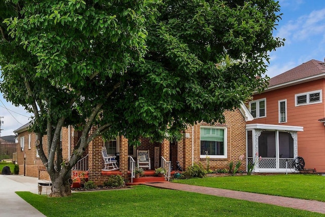 203 E S St, Union, SC 29379 - view of front of property with a front lawn and brick siding