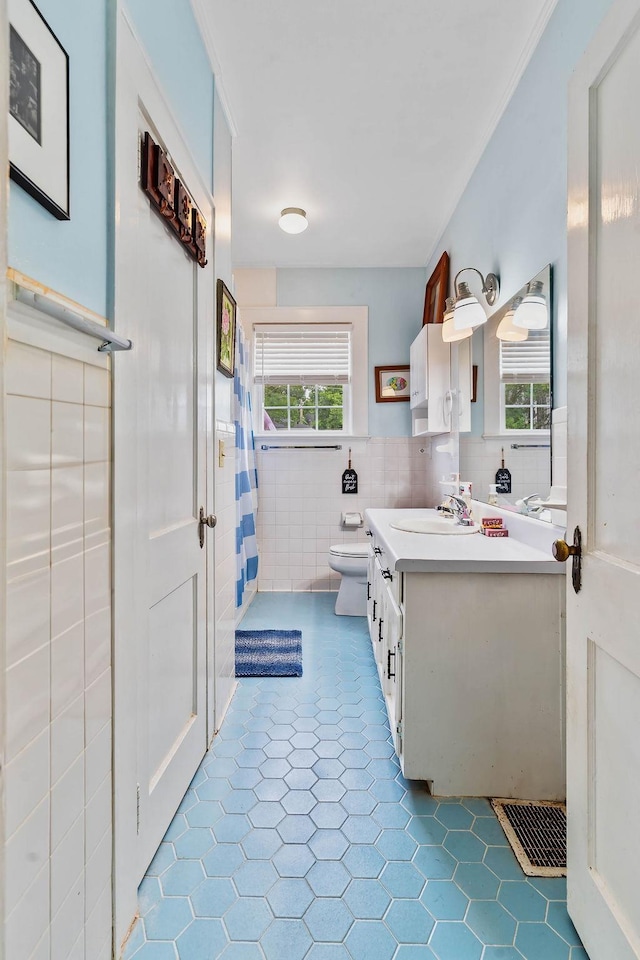 203 E S St, Union, SC 29379 - bathroom with tile walls, vanity, wainscoting, and tile patterned floors