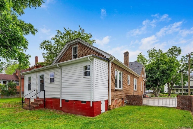 203 E S St, Union, SC 29379 - back of house with entry steps, a chimney, a lawn, and crawl space