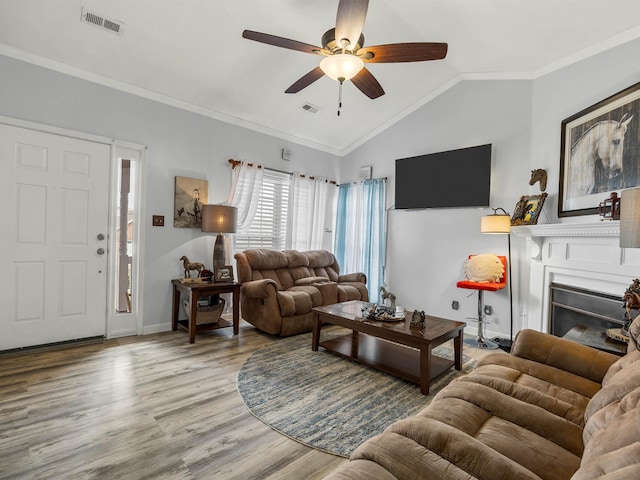 110 Hidden Ridge Dr, Spartanburg, SC 29301 - living area with ceiling fan, vaulted ceiling, wood finished floors, a fireplace, and ornamental molding