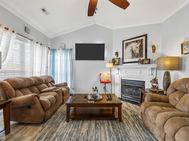 110 Hidden Ridge Dr, Spartanburg, SC 29301 - living area with wood finished floors, ceiling fan, crown molding, a fireplace with flush hearth, and lofted ceiling