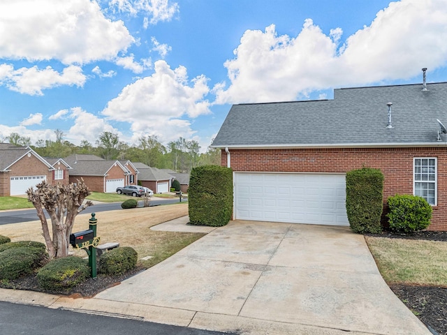 110 Hidden Ridge Dr, Spartanburg, SC 29301 - view of property exterior with brick siding, driveway, a shingled roof, and a garage