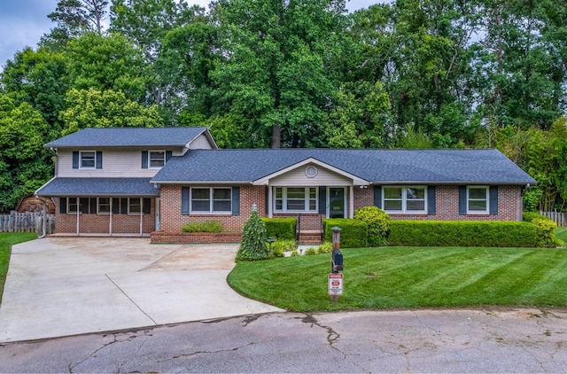 2250 Hickory Dr, Spartanburg, SC 29302 - view of front of home with brick siding, driveway, covered porch, and a shingled roof
