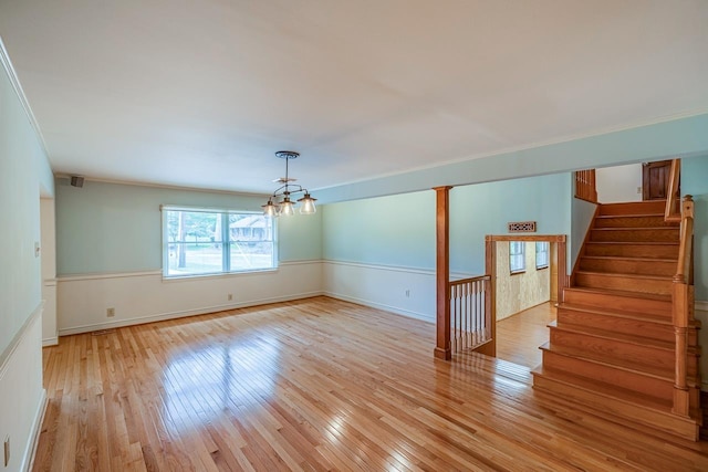 2250 Hickory Dr, Spartanburg, SC 29302 - unfurnished room with a chandelier, light wood-style flooring, stairs, and crown molding