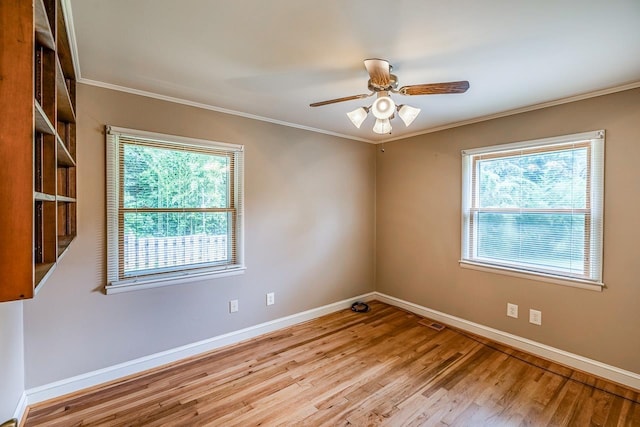 2250 Hickory Dr, Spartanburg, SC 29302 - empty room featuring wood finished floors, plenty of natural light, crown molding, and ceiling fan