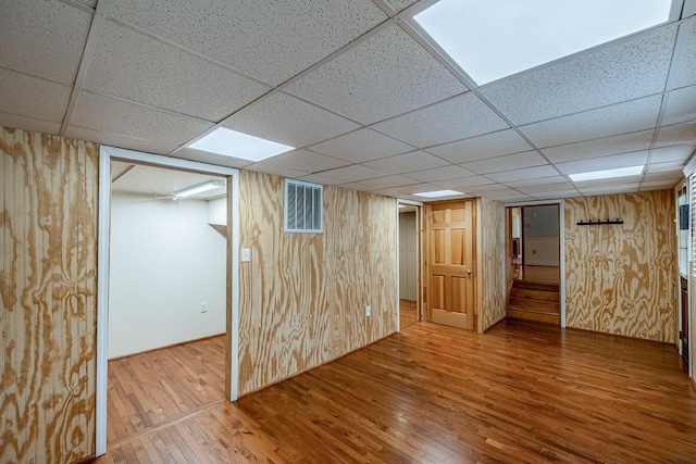 2250 Hickory Dr, Spartanburg, SC 29302 - finished basement featuring a paneled ceiling, wood finished floors, and wood walls