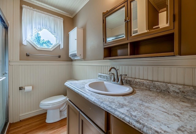 2250 Hickory Dr, Spartanburg, SC 29302 - bathroom with vanity, wainscoting, crown molding, wood finished floors, and a shower with shower door