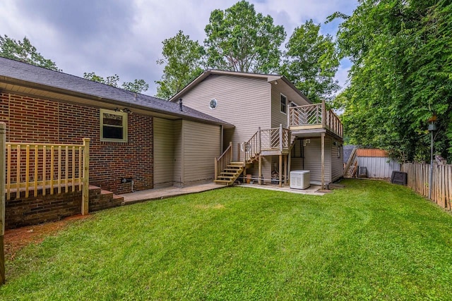 2250 Hickory Dr, Spartanburg, SC 29302 - back of house featuring stairs, a storage unit, a deck, a fenced backyard, and brick siding