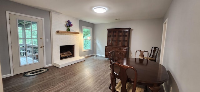 192 Wellesley Dr, Spartanburg, SC 29307 - dining space featuring dark wood finished floors and a brick fireplace