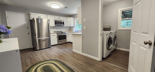 192 Wellesley Dr, Spartanburg, SC 29307 - kitchen with stainless steel appliances, independent washer and dryer, dark wood finished floors, and light countertops