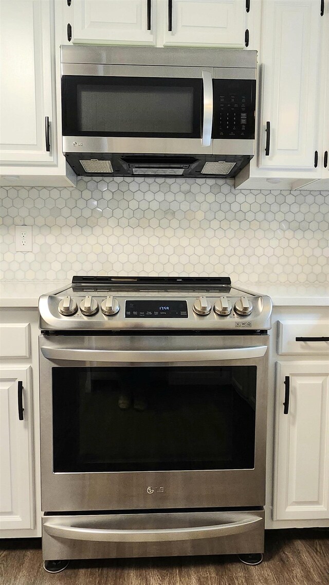 192 Wellesley Dr, Spartanburg, SC 29307 - kitchen with stainless steel appliances, light countertops, backsplash, and white cabinetry