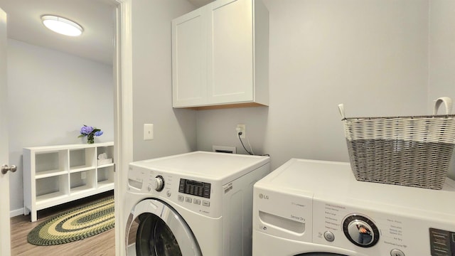 192 Wellesley Dr, Spartanburg, SC 29307 - laundry room with independent washer and dryer, cabinet space, and wood finished floors