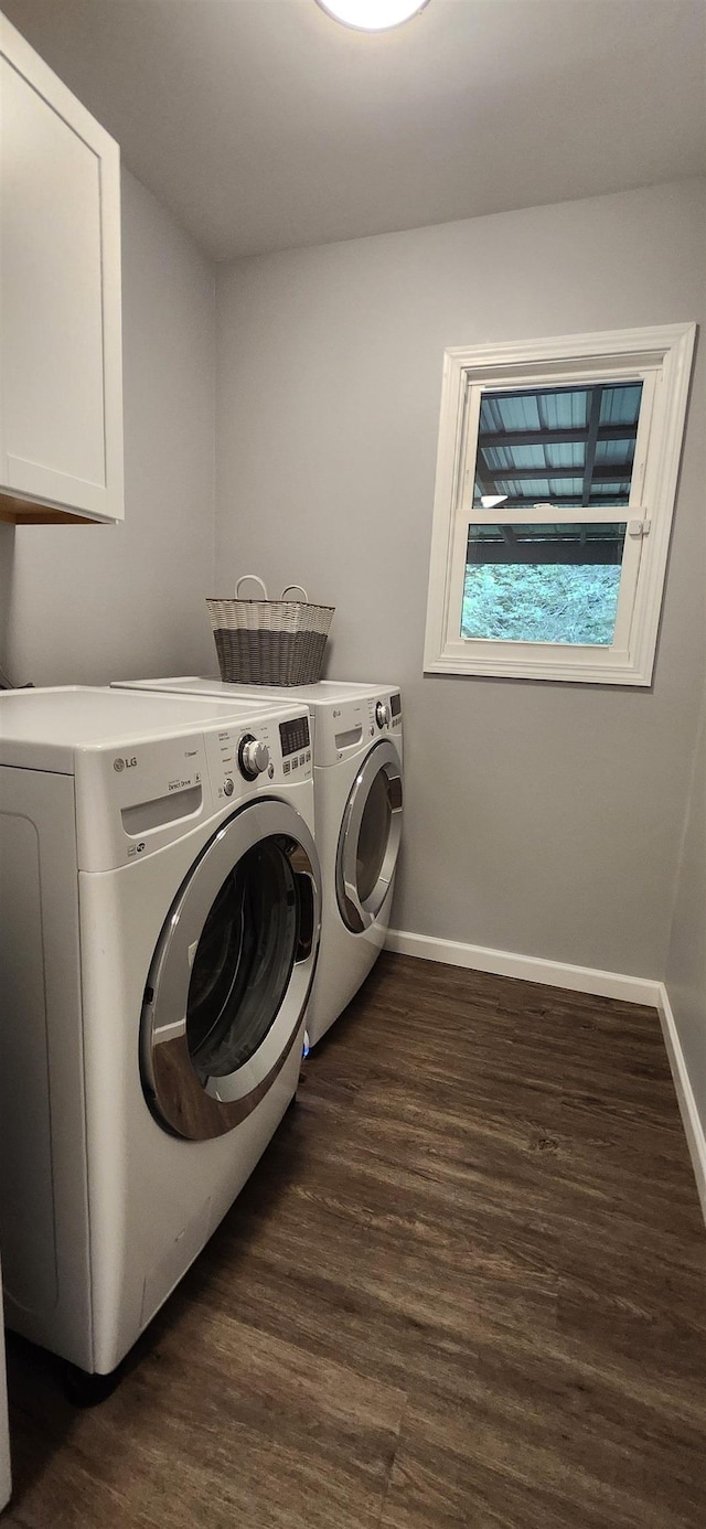 192 Wellesley Dr, Spartanburg, SC 29307 - laundry room featuring cabinet space, washing machine and clothes dryer, and dark wood-type flooring