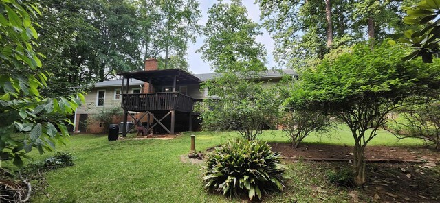 192 Wellesley Dr, Spartanburg, SC 29307 - rear view of house with a lawn, a chimney, and a deck