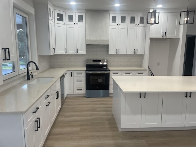 115 Hickory Hollow Rd, Inman, SC 29349 - kitchen with appliances with stainless steel finishes, decorative backsplash, light wood finished floors, white cabinetry, and recessed lighting