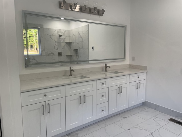 115 Hickory Hollow Rd, Inman, SC 29349 - full bath featuring marble look tile flooring, double vanity, and a marble finish shower
