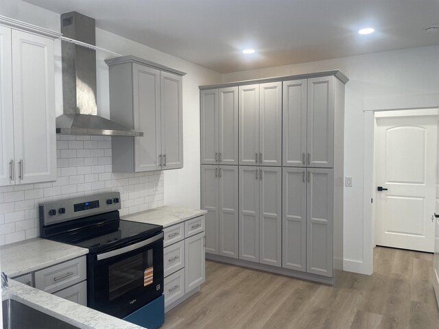 115 Hickory Hollow Rd, Inman, SC 29349 - kitchen with wall chimney exhaust hood, electric stove, light stone countertops, gray cabinetry, and backsplash