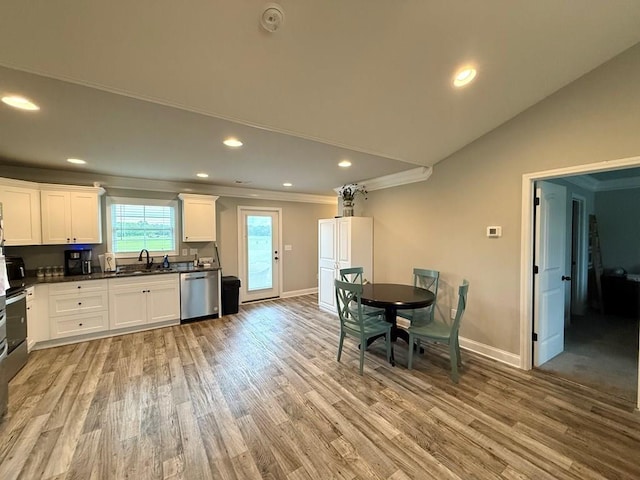 115 Rolling Mill Rd, Gaffney, SC 29340 - kitchen with dishwasher, light wood finished floors, dark countertops, recessed lighting, and white cabinets