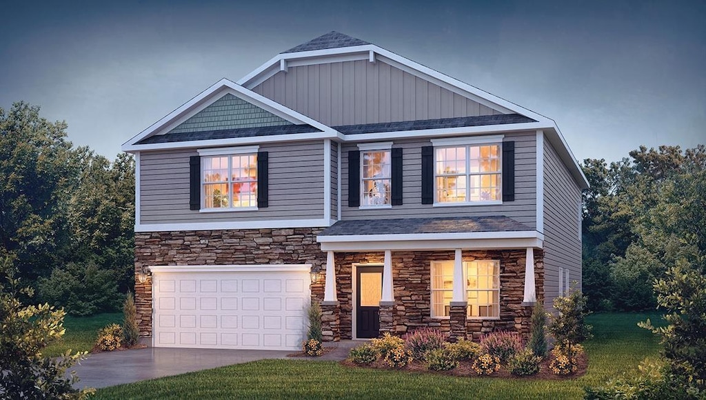 1353 Chamomile Ct, Lyman, SC 29365 - craftsman inspired home with stone siding, driveway, a garage, covered porch, and a front yard