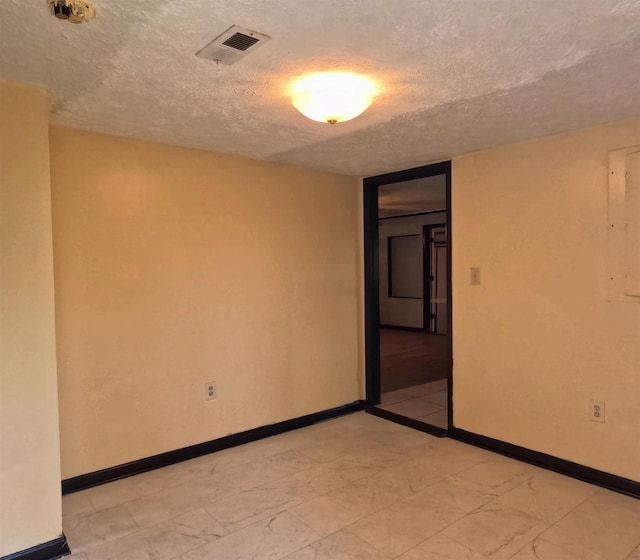 105 Anderson St, Spartanburg, SC 29301 - empty room with a textured ceiling and light marble finish flooring