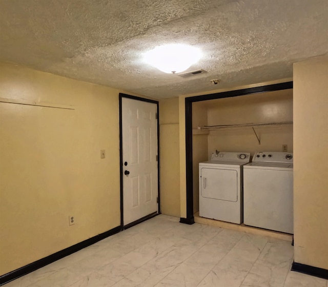 105 Anderson St, Spartanburg, SC 29301 - washroom with washer and dryer and a textured ceiling