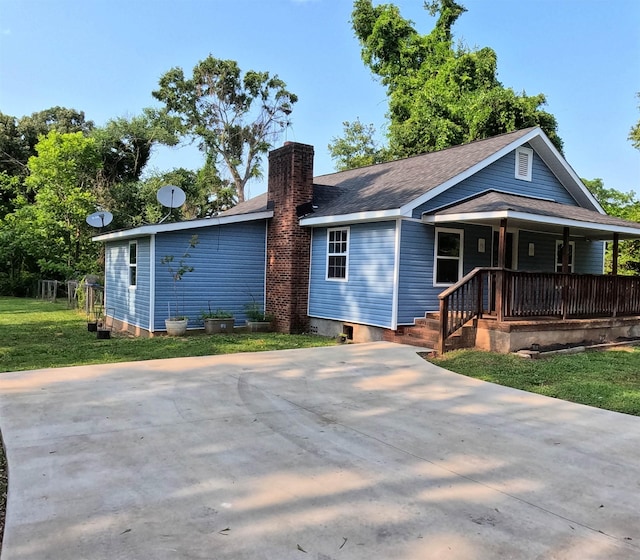 105 Anderson St, Spartanburg, SC 29301 - view of front of property featuring a chimney, a porch, a shingled roof, and a front lawn