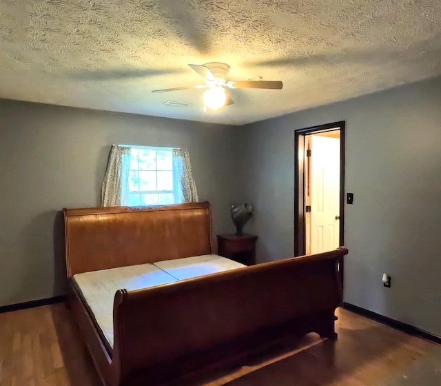 105 Anderson St, Spartanburg, SC 29301 - bedroom with wood finished floors, a textured ceiling, and ceiling fan