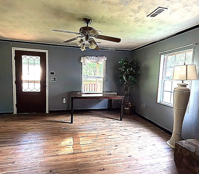 105 Anderson St, Spartanburg, SC 29301 - unfurnished office with plenty of natural light, ceiling fan, wood finished floors, crown molding, and a textured ceiling