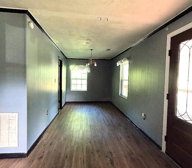 105 Anderson St, Spartanburg, SC 29301 - unfurnished dining area featuring wood finished floors, a chandelier, and crown molding