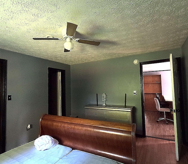 105 Anderson St, Spartanburg, SC 29301 - bedroom with wood finished floors, a textured ceiling, and ceiling fan
