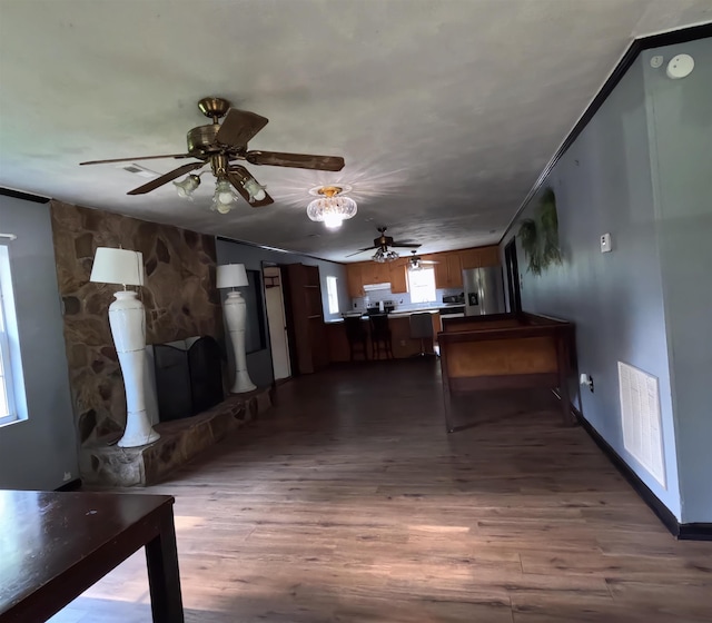 105 Anderson St, Spartanburg, SC 29301 - unfurnished living room featuring a ceiling fan and dark wood-type flooring