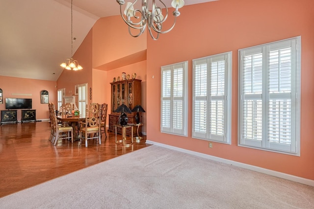 427 Listrac Dr, Moore, SC 29369 - dining room featuring a chandelier, carpet, and high vaulted ceiling