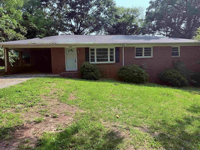 213 Loring St, Spartanburg, SC 29302 - single story home featuring driveway, a front yard, a carport, and brick siding