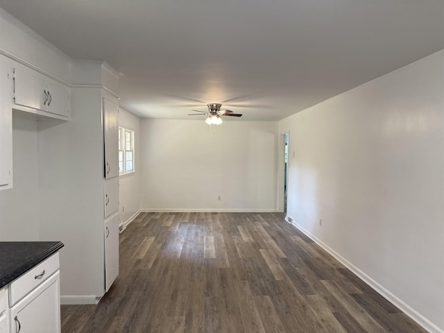 213 Loring St, Spartanburg, SC 29302 - unfurnished dining area with ceiling fan and dark wood-style flooring