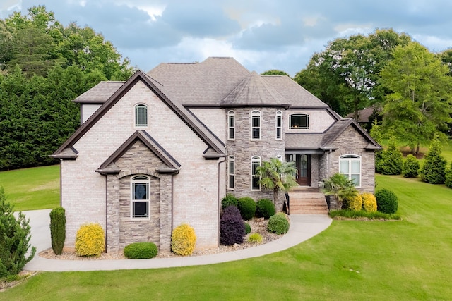 740 N Alamosa Dr, Boiling Springs, SC 29316 - french provincial home with a front lawn, stone siding, and a shingled roof