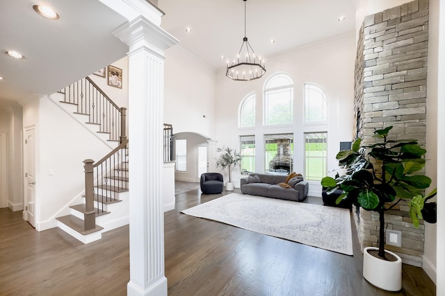740 N Alamosa Dr, Boiling Springs, SC 29316 - entryway featuring decorative columns, arched walkways, stairs, wood finished floors, and ornamental molding