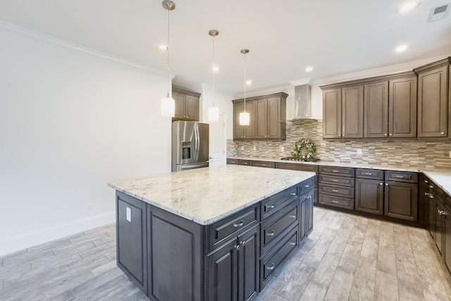 740 N Alamosa Dr, Boiling Springs, SC 29316 - kitchen featuring wall chimney exhaust hood, stainless steel appliances, ornamental molding, light wood-style floors, and a kitchen island
