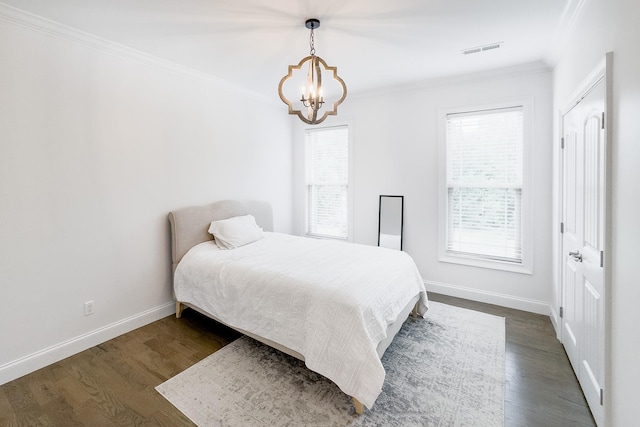 740 N Alamosa Dr, Boiling Springs, SC 29316 - bedroom with ornamental molding, a chandelier, and dark wood finished floors