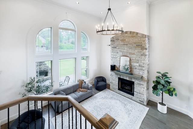 740 N Alamosa Dr, Boiling Springs, SC 29316 - living area featuring wood finished floors, a fireplace, a chandelier, ornamental molding, and recessed lighting