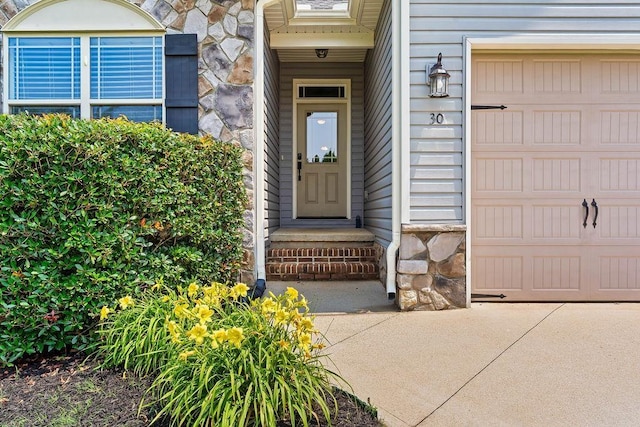 30 Caperton Way, Greer, SC 29651 - property entrance featuring stone siding and an attached garage