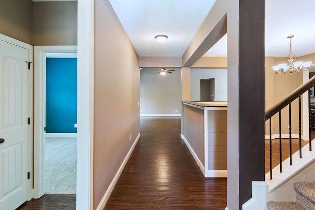 30 Caperton Way, Greer, SC 29651 - corridor featuring dark wood-style floors, a chandelier, and stairway