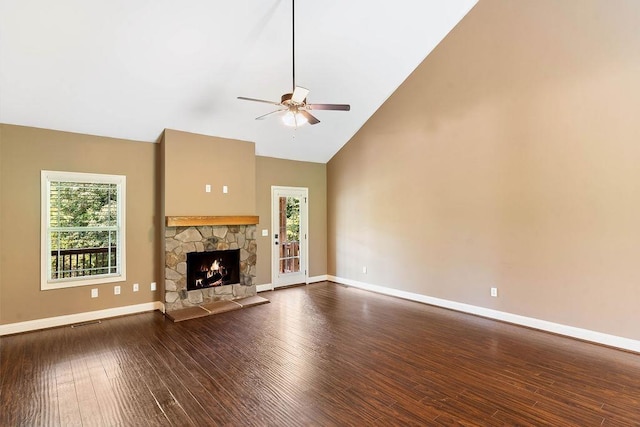 30 Caperton Way, Greer, SC 29651 - unfurnished living room featuring ceiling fan, plenty of natural light, high vaulted ceiling, dark wood finished floors, and a stone fireplace