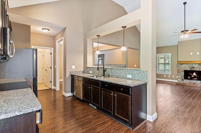30 Caperton Way, Greer, SC 29651 - kitchen featuring stainless steel appliances, ceiling fan, dark brown cabinets, dark wood-style flooring, and high vaulted ceiling