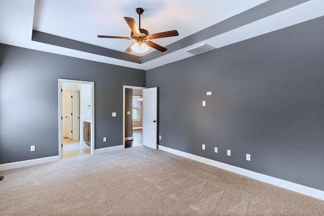 30 Caperton Way, Greer, SC 29651 - unfurnished bedroom featuring a tray ceiling, carpet, and ceiling fan