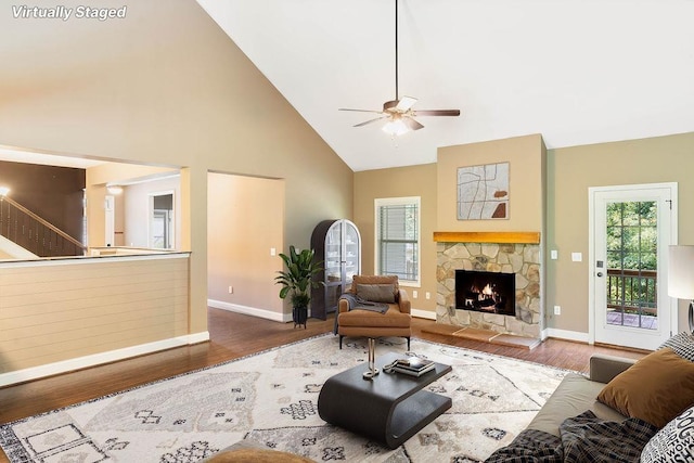 30 Caperton Way, Greer, SC 29651 - living room featuring high vaulted ceiling, wood finished floors, a ceiling fan, a fireplace, and stairs