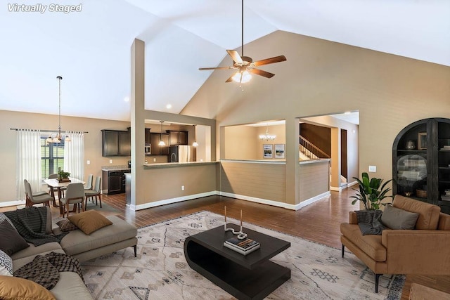 30 Caperton Way, Greer, SC 29651 - living room with a chandelier, wood finished floors, ceiling fan, and high vaulted ceiling