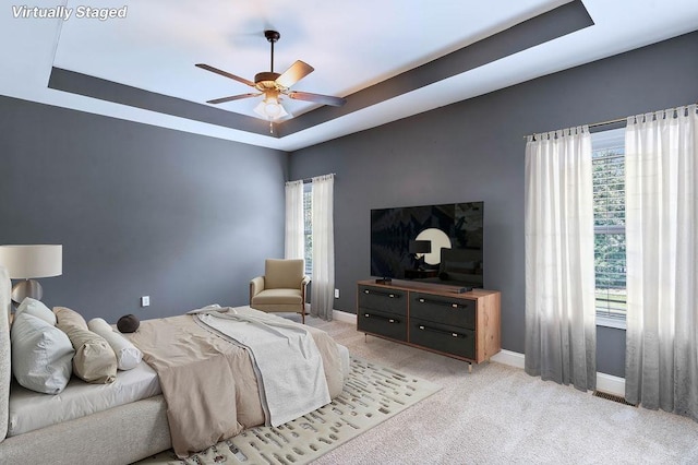 30 Caperton Way, Greer, SC 29651 - bedroom with a raised ceiling, light colored carpet, and a ceiling fan