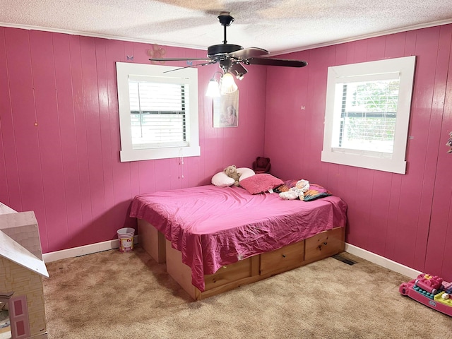 355 Blue Ridge Rd, Campobello, SC 29322 - bedroom with multiple windows, a textured ceiling, carpet, ceiling fan, and wooden walls