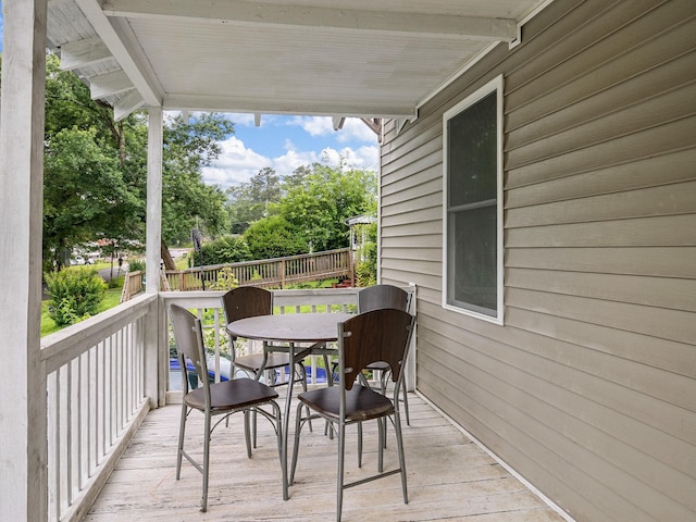 24 Oak St, Spartanburg, SC 29306 - wooden terrace with outdoor dining space